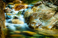 PH2029a creek smooth water and rocks LynnValley pfx zf-1272-3