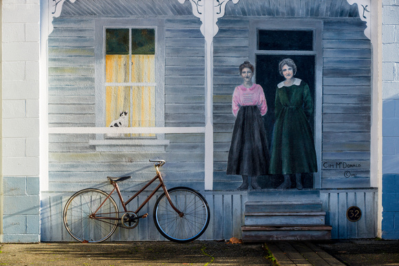 PH1627a art mural cim mcdonald women on porch with bicycle zf-7817
