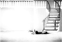 woman sleeping on stage below stairs PH2509a -4674