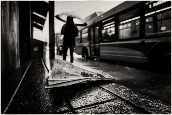 PH2480a folio urban Vancouver wet newspaper and pedestrian with umbrella nss zf-7237